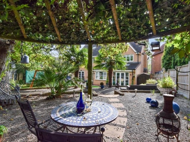 The back garden also includes a tiered seating area. A lovely spot in the summer.
