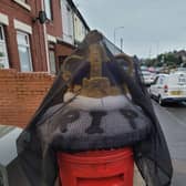 The adapted topper sits on a postbox in Victoria Road, Kirkby.