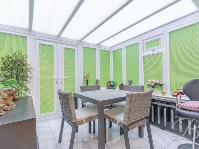 Next stop at the £525,000 Mansfield property is this terrific conservatory, with made-to-measure blinds, enabling you to admire the garden. French doors lead outside, and there is space for a dining table.