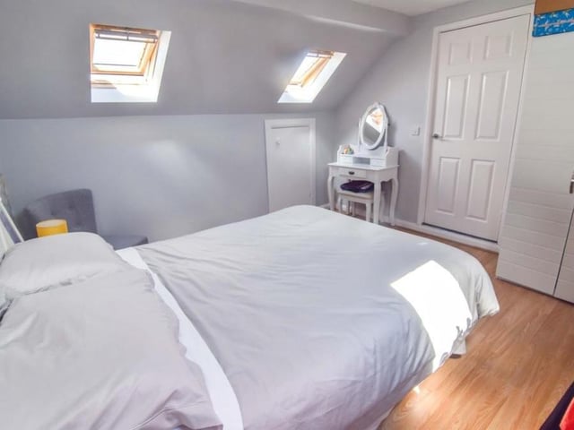 On the first floor of the £430,000-plus dormer bungalow are two more double bedrooms, including this one.
