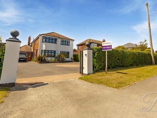 Let's start our photo gallery at the front of the Derby Road property. It sits on a hugely attractive plot.