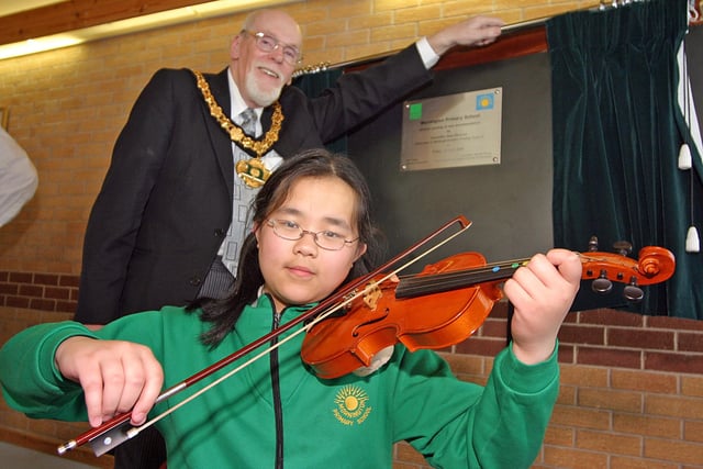 2006: At the opening of the refurbished Mornington Primary School in Nuthall are county council chairman Alan Davidson and pupil Xin Xien Chan.