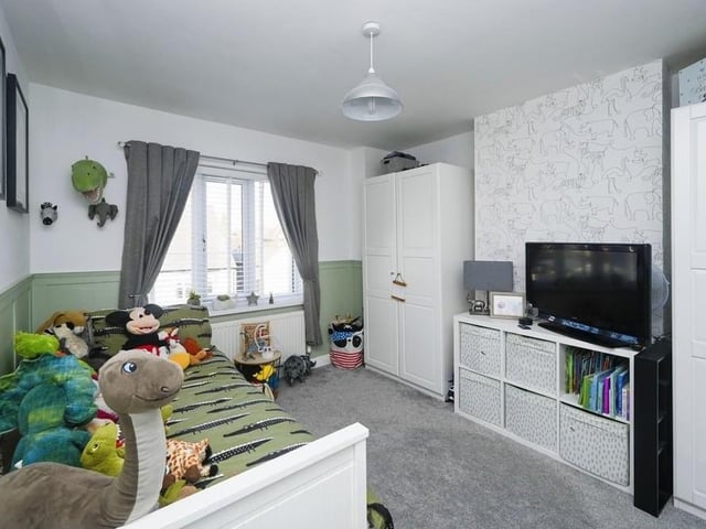 The second bedroom is also a generous size, with plenty of space for storage. It also looks as if it is full of fun!