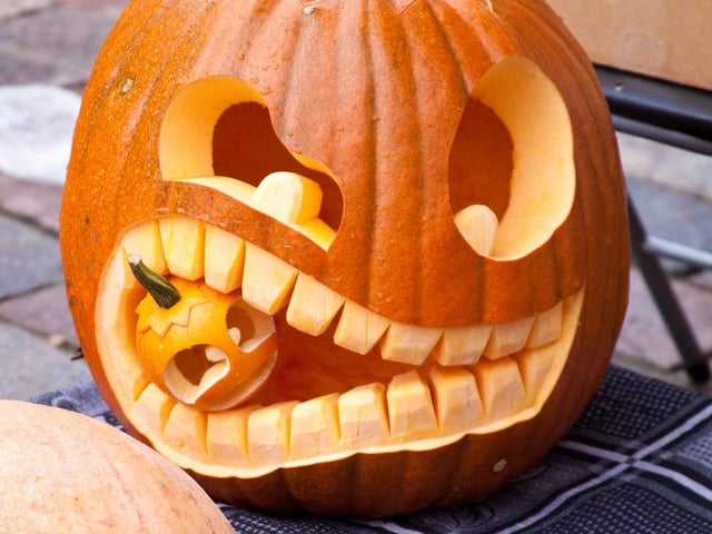 If you have a really small pumpkin, as well as your regular sized pumpkin, you can make it look like your big pumpkin is eating the small one.
