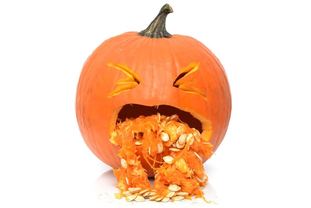 By using the innards of the pumpkin, like the seeds and other goop you scoop out, you can create a pumpkin that looks like it’s throwing up.