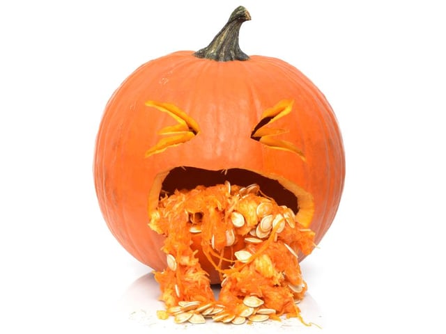 By using the innards of the pumpkin, like the seeds and other goop you scoop out, you can create a pumpkin that looks like it’s throwing up.