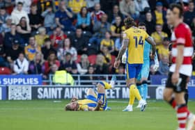 Alfie Kilgour lies injured during the Sky Bet League 2 match against Doncaster Rovers FC at the Eco-Power Stadium  
Photo Chris & Jeanette Holloway / The Bigger Picture.media
