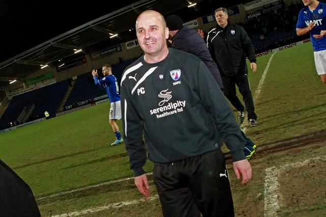 Paul Cook looks happy after seeing his side get through to Wembley.