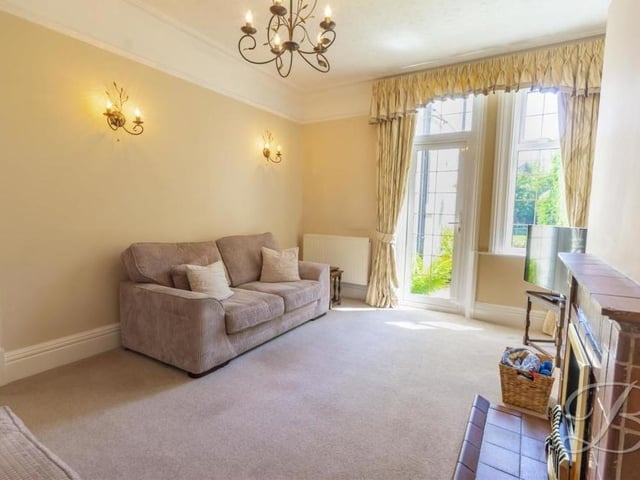 The lounge is as charming and comfortable as the living room. A door provides convenient access to the exterior at the side of the property.