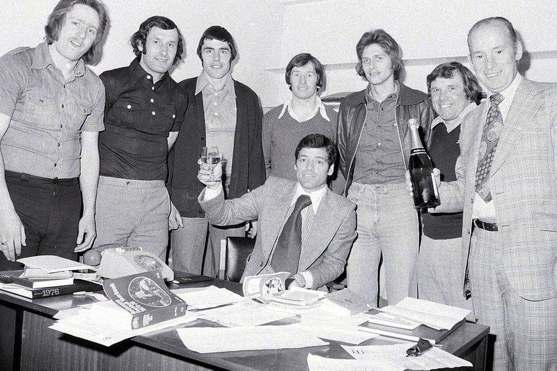 Stags celebrate promotion. Pictured from the left: Kevin Bird, Kevin Randall, Ernie Moss, Ian McDonald, Ian McKenzie, Jerry Clarke, coach, and club chairman Arthur Patrick. Seated is team manager Peter Morris.