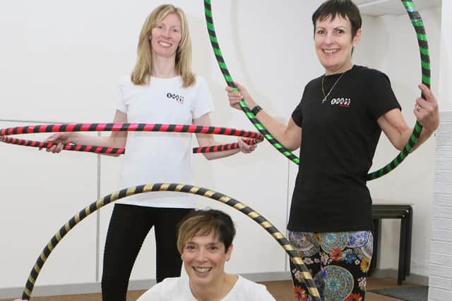 Helen Garner, Nicky Blakey and Jane Brown from Shape Fitness demonstrating their Hula Hooping skills.