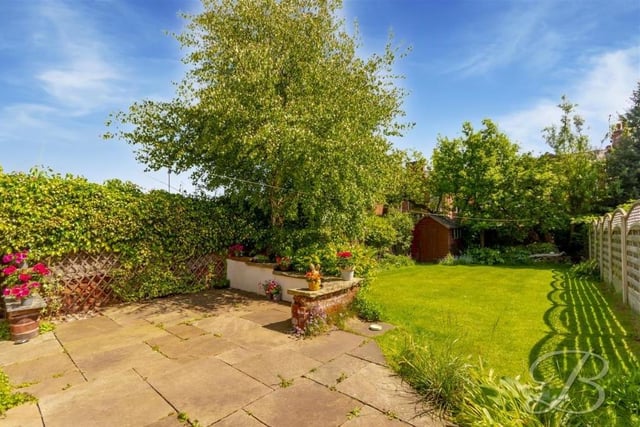A final shot of the back garden at the £250,000-plus property. It is nicely enclosed by surrounding fencing and hedges, offering a good degree of privacy.
