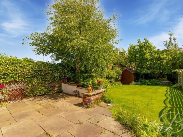 A final shot of the back garden at the £250,000-plus property. It is nicely enclosed by surrounding fencing and hedges, offering a good degree of privacy.