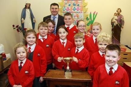 2012: Pupils at Priory Roman Catholic School are pictured with the Rodney Cup Memorial Trophy for raising the most money selling poppies.