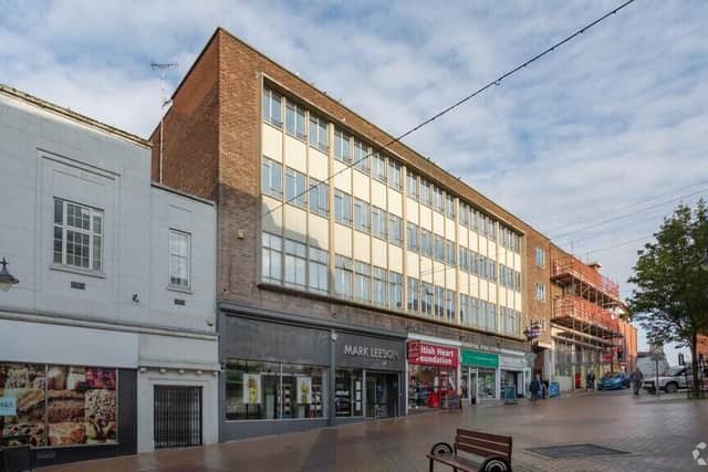 The four shops on the ground floor of Ashmead Chambers would continue to operate if the apartments plan is given the go-ahead. (PHOTO BY: Google Maps)