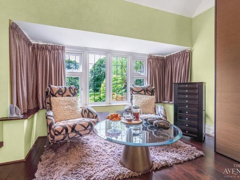 The master bedroom also features this delightful sitting area, by one of its large windows overlooking the garden.