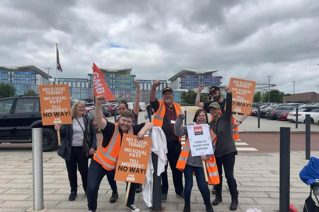Cameron Mitchell with striking workers.