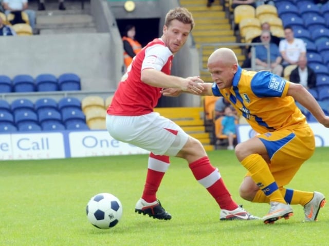 Lindon Meikle takes on Johnny Mullins in a 2012 pre-season game.