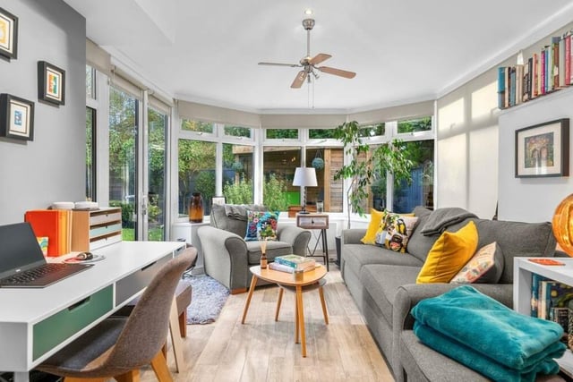 This second image underlines what a spectacular space the garden room is. Doors open out to the garden and large windows give superb views. There are multiple seating areas and feature lighting too.