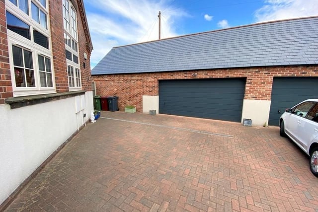 The double garage at the £320,000 Goose Green Lane property has manual up-and-over-doors, lighting and electrics.