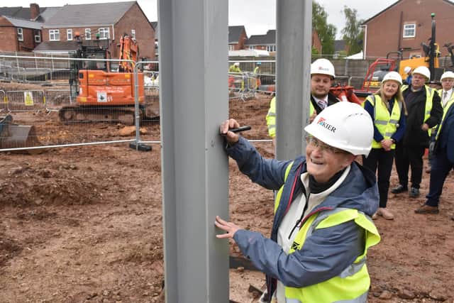 Coun Rachel Madden signs the girder at the new leisure centre site in Kirkby.