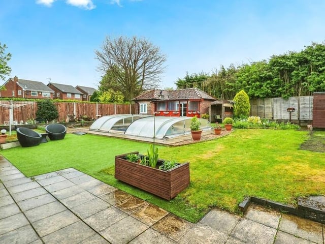 An outdoor pool and, beyond that, a small annexe are the highlights of the generously-sized back garden, which is fully enclosed with fencing. It includes a lawn and a variety of plants, bushes and shrubs.