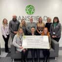 Image: Alice Grewcock, Alzheimer’s Society, with members of Mansfield Building Society’s Charity Committee.