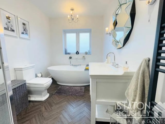 There is a fantastic sized bathroom which has a freestanding oval bath and walk-in shower. This lovely room has a tranquil feel, ideal to wind down at the end of a busy day.