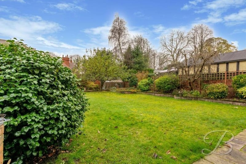 We say farewell to the Edwardian property with another image of the leafy back garden, which also includes a patio seating area that is just out of shot.