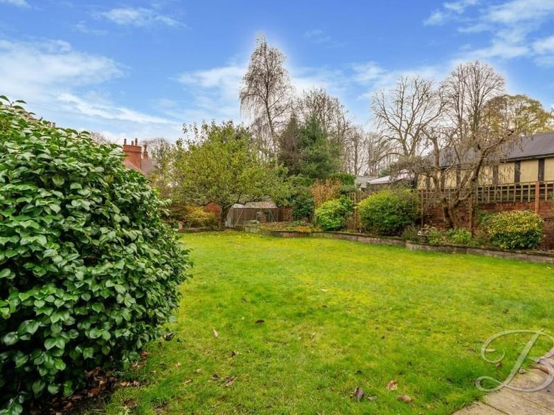 We say farewell to the Edwardian property with another image of the leafy back garden, which also includes a patio seating area that is just out of shot.