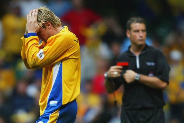 Liam Lawrence of Mansfield Town holds his head after he missed a penalty during the Nationwide Division Three Play-Off Final in Cardiff.