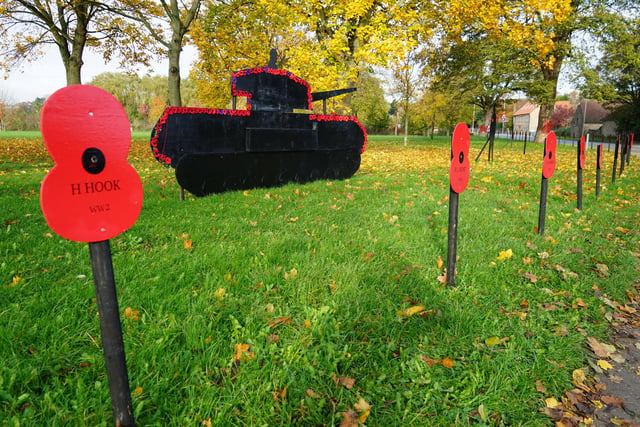 Names of soldiers from World War I and II included in the poppy and remembrance display.