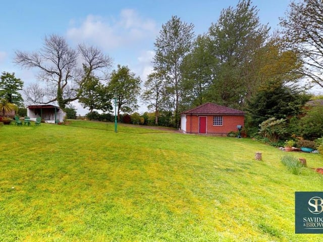 The final photo of our gallery focuses again on the large, well-maintained lawns that wrap themselves around the property. Ideal for relaxation or play.