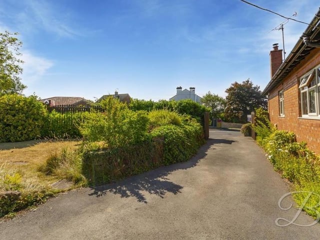 Our final photo of the Mansfield bungalow shows the driveway and the garden to the side. Contact BuckleyBrown if you're interested in a viewing.