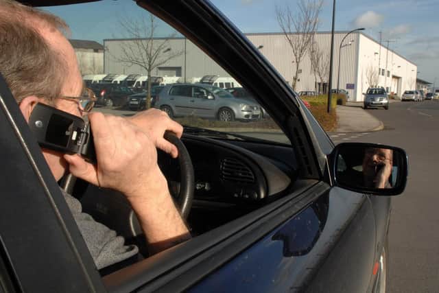 The number of fines handed out to drivers in Nottinghamshire for using their mobile phones at the wheel has risen by more than half following an update to the law
