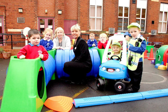 Michelle Banks of the Sunderland Housing Group was pictured with pupils after the group made a £300 donation towards playground equipment.