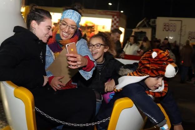 The Fines family - Daisey, Jaymie, Leah, and Ethan share a fun moment together on the classic teacup ride in 2017