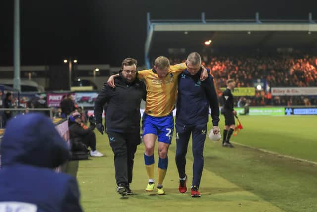 Injured Mansfield Town defender Frazer Blake-Tracy(22) at the Sky Bet League One match against Lincoln City FC at the One Call Stadium, 18 Feb 2025, Photo credit Chris & Jeanette Holloway / The Bigger Picture.media