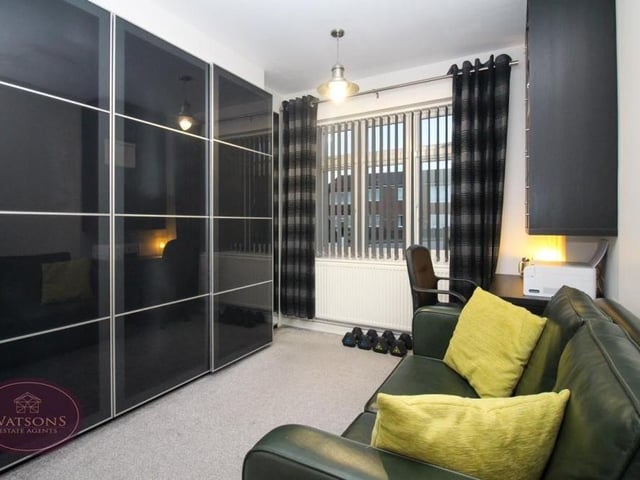 The second bedroom, which faces the front of the property, is a similar size to the first and also includes fitted wardrobes.