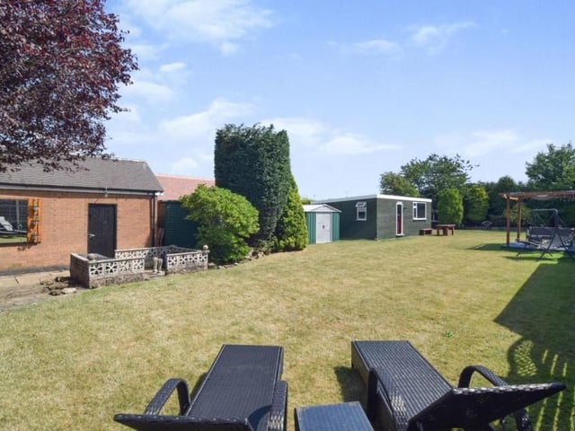 A look down the garden, which is private and enclosed. The lawn has been well maintained.