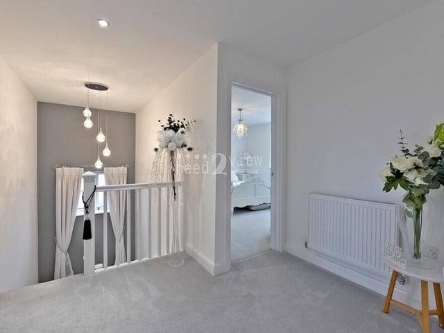At the top of the stairs, you are greeted by this first-floor landing, which leads to all three bedrooms and the family bathroom. It also has access to a loft space.