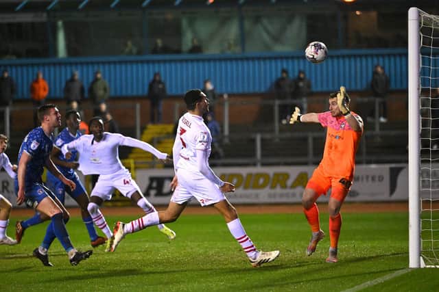 Jon Russell heads past new Stags team mate Harry Lewis when Carlisle faced Barnsley in March 2024.