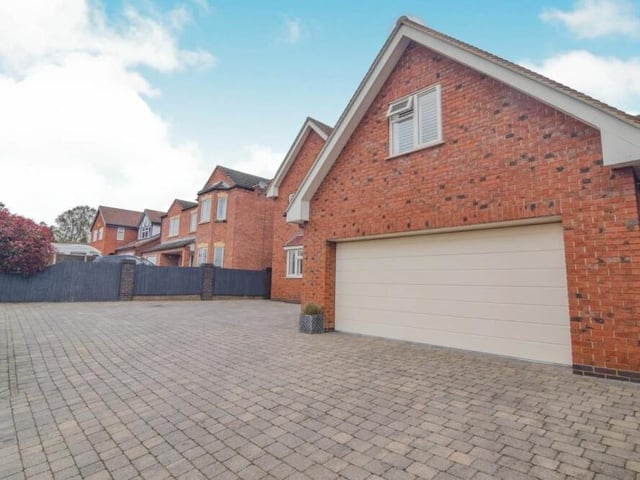 Time to take in the excellence of the exterior now, beginning with the impressive double garage. It stands proudly on a driveway that offers off-street parking space for many vehicles.