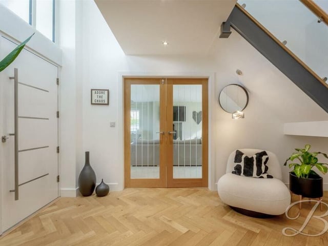 The wow factor hits you as soon as you step through the grand front door to the £650,000 Pleasley Vale property. For a double-vaulted entrance hallway, with a floor of herringbone wood and contemporary staircase, floods natural light through the whole house.
