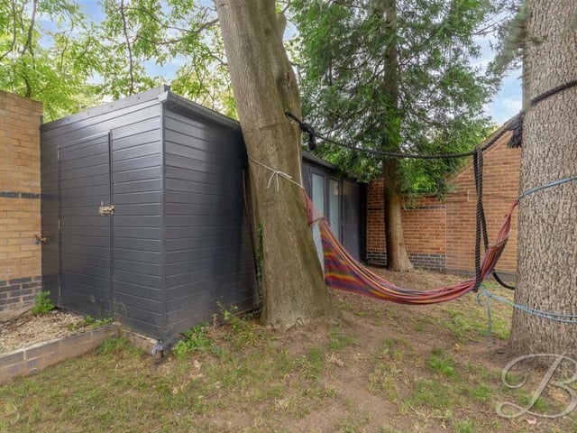 As well as the detached garage, the garden includes this second outbuilding,