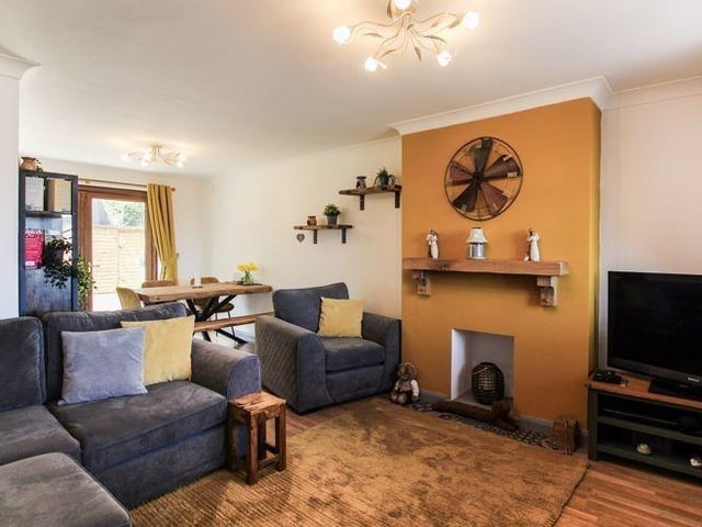 As we step through the front door of the South Normanton property and move through the entrance hall, the first room we come to is this living room/diner. It occupies the right-hand portion of the ground floor.