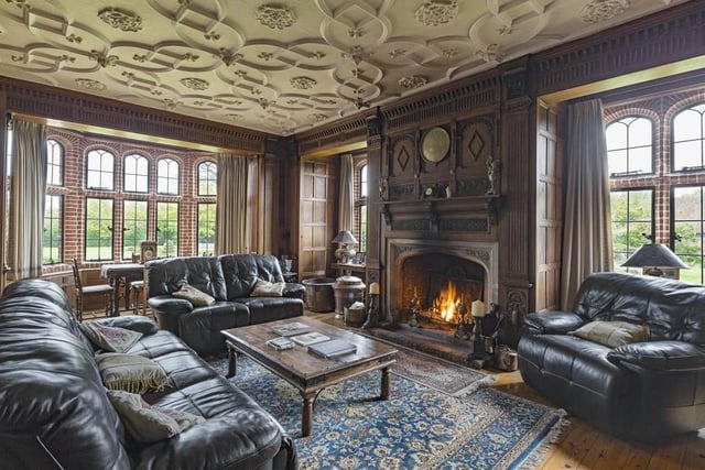 Take a fireside seat in the sitting room at Stanstead Hall. The property retains many of its original features and design.