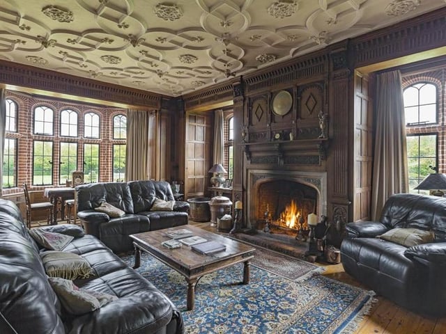 Take a fireside seat in the sitting room at Stanstead Hall. The property retains many of its original features and design.
