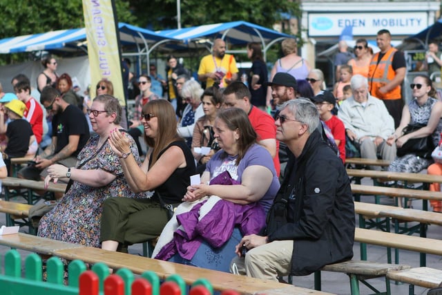 Full Shebang audiences in the Market Square, Mansfield, viewing street performances.