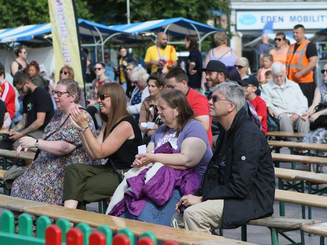 Full Shebang audiences in the Market Square, Mansfield, viewing street performances.
